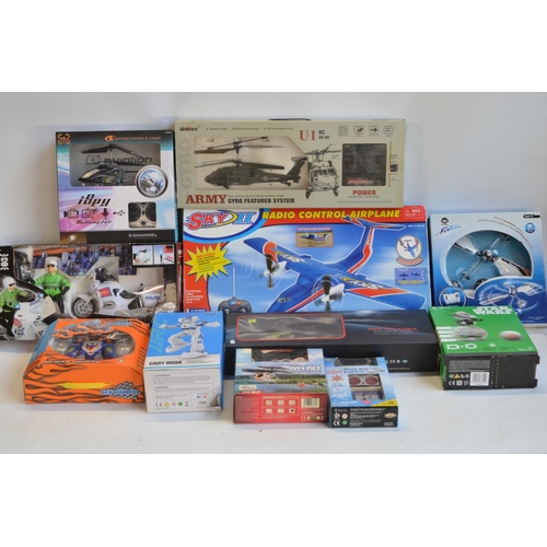 1345 - Collection of boxed radio controlled aircraft, helicopters, Police motorbike, a Cady Wini gesture co... 