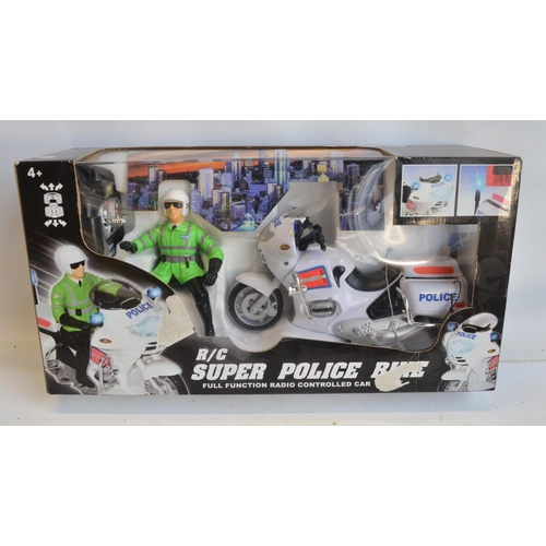 1345 - Collection of boxed radio controlled aircraft, helicopters, Police motorbike, a Cady Wini gesture co... 