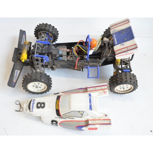 1346 - Tamiya Boomerang and Maverick Strada battery powered 4 wheel drive radio controlled cars, both in wo... 