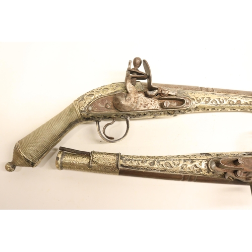 103 - Pair of Balkan silver covered decorative flintlock pistols, 9.5