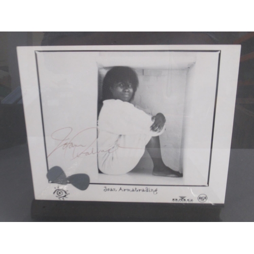 921 - Framed and signed Joan Armatrading picture with 2 guitar picks and a photo album collection of Joan ... 