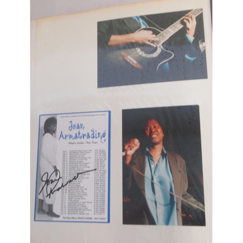 921 - Framed and signed Joan Armatrading picture with 2 guitar picks and a photo album collection of Joan ... 