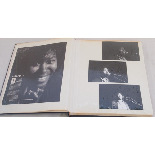 921 - Framed and signed Joan Armatrading picture with 2 guitar picks and a photo album collection of Joan ... 