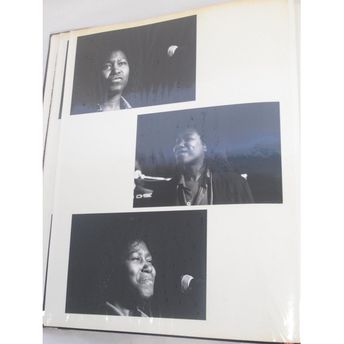 921 - Framed and signed Joan Armatrading picture with 2 guitar picks and a photo album collection of Joan ... 