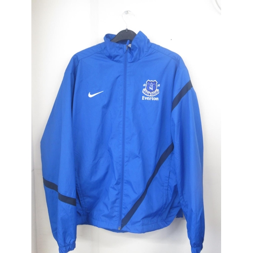 935 - Everton F.C. - Large collection of Everton F.C. football shirts, tracksuit tops,etc., in various siz... 