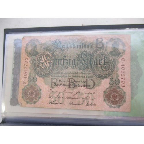 814 - Red banknotes folder cont. c20th Polish, Italian, Algerian and German banknotes (103)