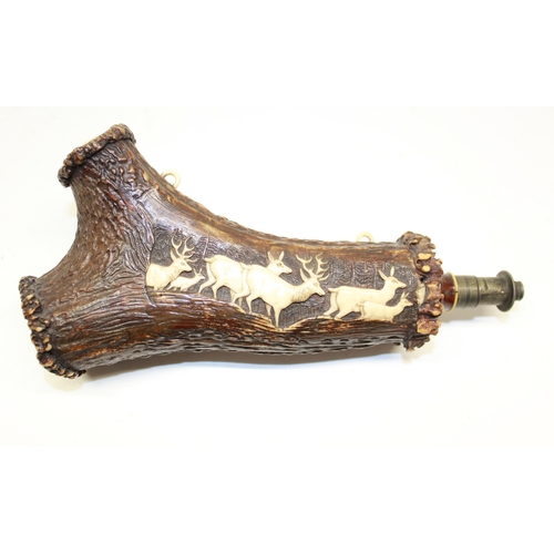 168 - 19th century German staghorn antler powder flask, body with relief carved panel of deer, push measur... 