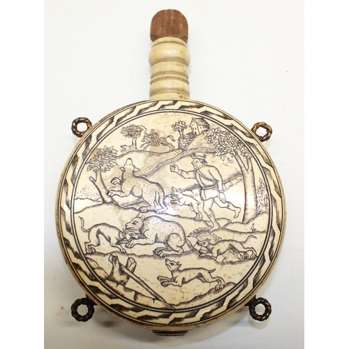 175 - Circular bone etched moon shaped powder flask in the Early 17th century style, decorated with huntin... 