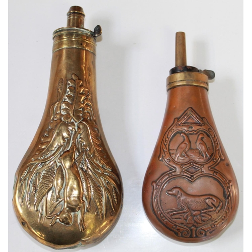 180 - Brass powder flask with hanging game design. Brass and copper powder flask with embossed dog and phe... 