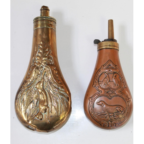 180 - Brass powder flask with hanging game design. Brass and copper powder flask with embossed dog and phe... 