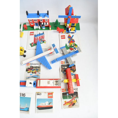 1405 - Twenty seven unboxed vintage Lego sets, C1970-80's to include construction, helicopters, aircraft, h... 