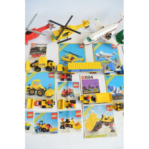 1405 - Twenty seven unboxed vintage Lego sets, C1970-80's to include construction, helicopters, aircraft, h... 