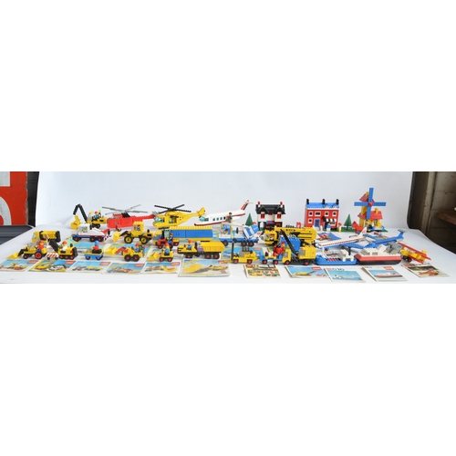 1405 - Twenty seven unboxed vintage Lego sets, C1970-80's to include construction, helicopters, aircraft, h... 