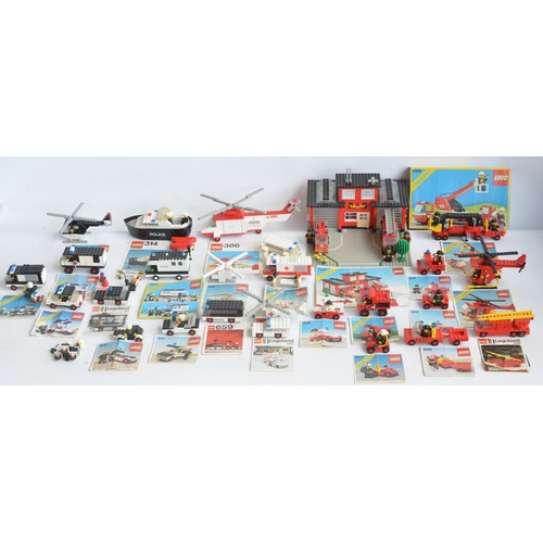 1406 - Twenty six unboxed vintage Lego Police, Fire and Ambulance sets all C1970-80's plus boxed set 6358, ... 