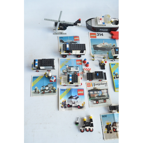 1406 - Twenty six unboxed vintage Lego Police, Fire and Ambulance sets all C1970-80's plus boxed set 6358, ... 