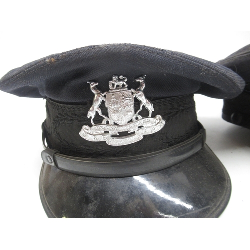 962 - H.J. Henochsberg, Johannesburg, three guard's peaked caps bearing South African Railways coat of arm... 