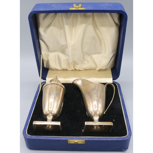 138 - Cased George V silver sugar caster and jug pair, both stood on square pedestal feet by Viner's Ltd, ... 