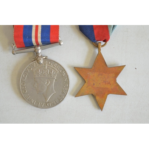 715A - World War II 1939-45 war medal and 1939-45 Star (no inscriptions) and 2 commemorative coins