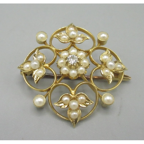 33 - 15ct yellow gold brooch set central seed pearl and diamond cluster, and seed pearl set foliage detai... 