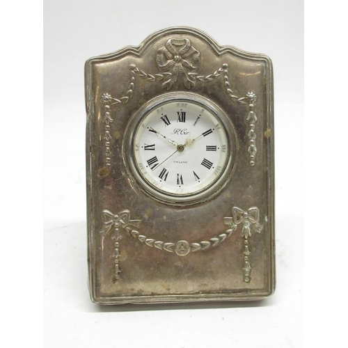 512 - R. Carr, Elizabeth II silver mounted easel quartz desk clock timepiece, embossed ribbon and bow deco... 