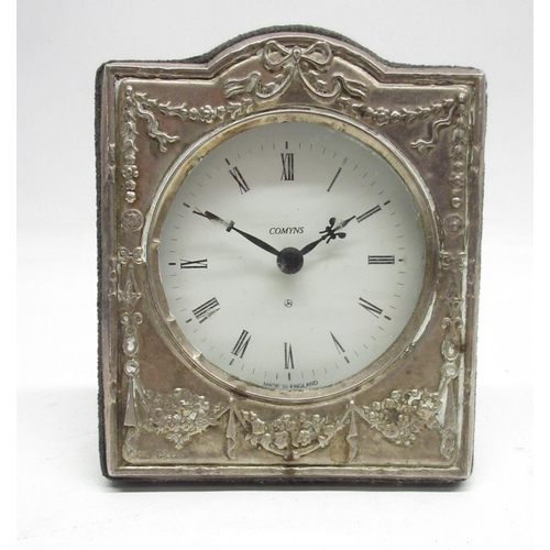 513 - Comyns, Elizabeth II silver mounted easel quartz desk clock timepiece, embossed ribbon and garland d... 