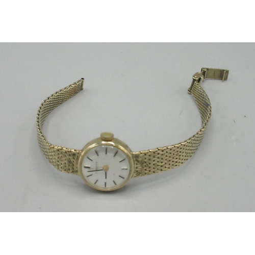 1198 - Tissot lady's 9ct gold wrist watch on integrated mesh bracelet stamped. 375, signed brushed silvered... 