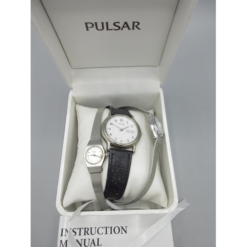 1201 - Pulsar stainless steel quartz wristwatch with day date, signed white Arabic dial, signed case back n... 