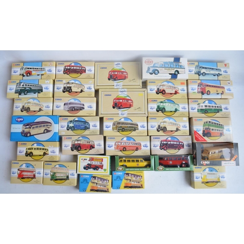 564 - Thirty two diecast bus and tram models from Corgi, Dinky and The Open Top Bus Company, models all ch... 