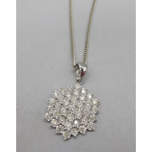 41 - 9ct white gold diamond cluster pendant on 9ct white gold chain, stamped 375,15.36g