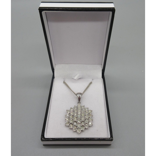 41 - 9ct white gold diamond cluster pendant on 9ct white gold chain, stamped 375,15.36g