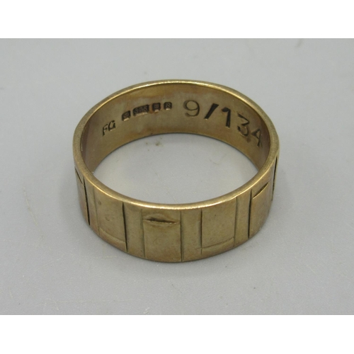 48 - 9ct yellow gold band ring with engraved design, stamped 375, size T1/2, 5.47g