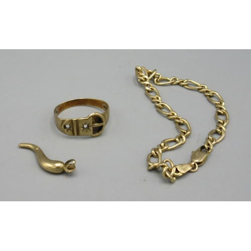 59 - 9ct yellow gold chain link bracelet, a 9ct gold belt ring, size S, and 9ct gold horn of plenty charm... 