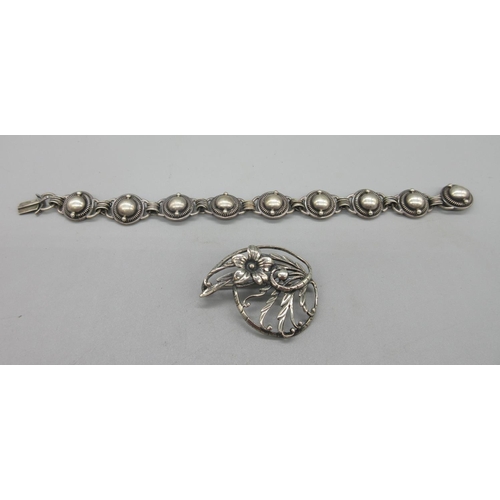 265 - Danecraft sterling circular brooch with floral openwork brooch, W4.5cm; and a Danish silver stylised... 