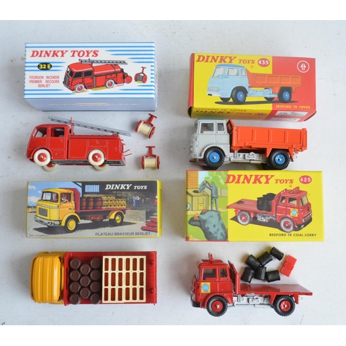 571 - Collection of modern reproduction Dinky Toys diecast model trucks and a road sign set from Atlas Edi... 