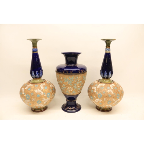 93 - Pair of Royal Doulton Lambeth Slaters bottle vases and a similar urn shaped vase, height of pair 41c... 