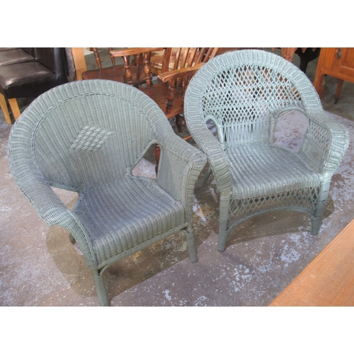 726 - Two C20th later blue painted canework arched back conservatory chairs (2)