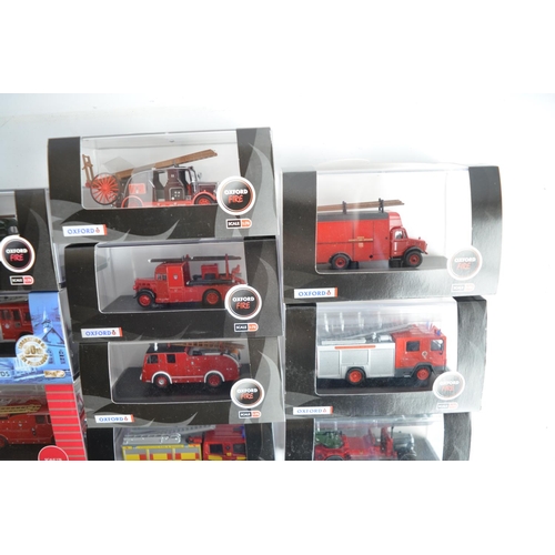 596 - Twenty four boxed 1/76 scale (OO gauge) diecast fire engine and related Fire Service models from Oxf... 