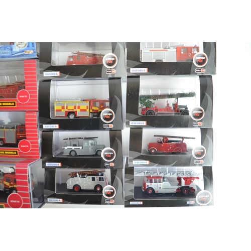 596 - Twenty four boxed 1/76 scale (OO gauge) diecast fire engine and related Fire Service models from Oxf... 