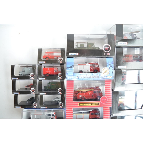 596 - Twenty four boxed 1/76 scale (OO gauge) diecast fire engine and related Fire Service models from Oxf... 