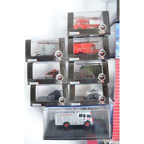 596 - Twenty four boxed 1/76 scale (OO gauge) diecast fire engine and related Fire Service models from Oxf... 