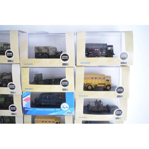 597 - Twenty five boxed 1/76 scale (OO gauge) diecast Military vehicle models from Oxford Diecast, model c... 