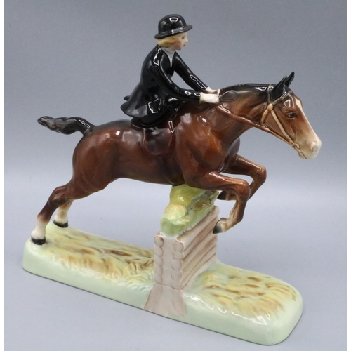 779 - Beswick side saddle huntswoman jumping on a brown horse, H25.5cm