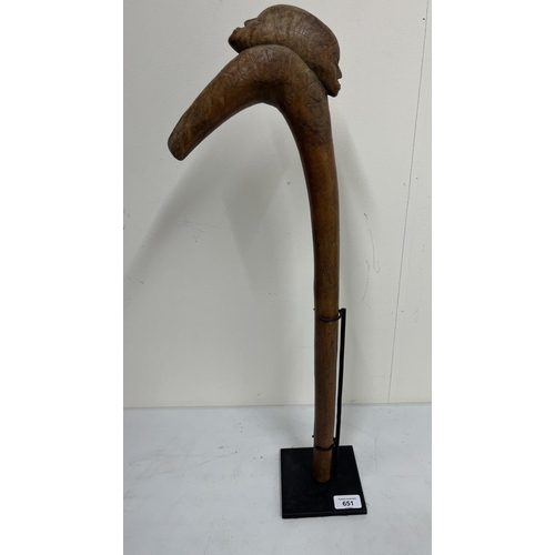 651 - African carved hardwood ceremonial war club on metal stand, H61cm