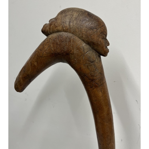 651 - African carved hardwood ceremonial war club on metal stand, H61cm