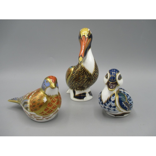 196 - Three Royal Crown Derby paperweights, comprising Pelican and Blue Duckling, both with silver stopper... 