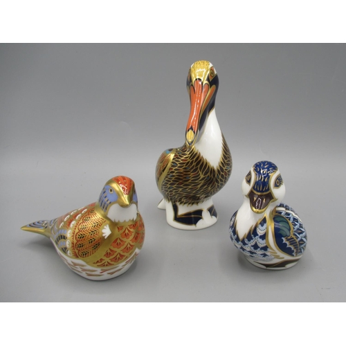 196 - Three Royal Crown Derby paperweights, comprising Pelican and Blue Duckling, both with silver stopper... 