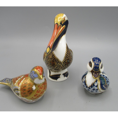 196 - Three Royal Crown Derby paperweights, comprising Pelican and Blue Duckling, both with silver stopper... 