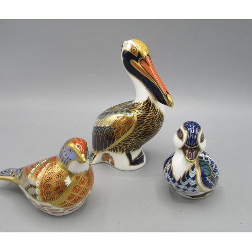 196 - Three Royal Crown Derby paperweights, comprising Pelican and Blue Duckling, both with silver stopper... 