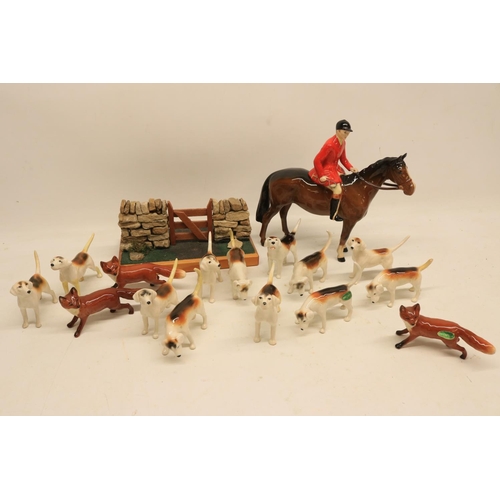 774 - Beswick huntsman on a brown horse, H20.5cm; 12 hounds incl. two A/F, and three foxes (16)