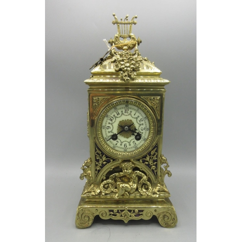 217 - Vincenti, French brass mantle clock, cast brass case, pierced fabric backed sound frets, 3